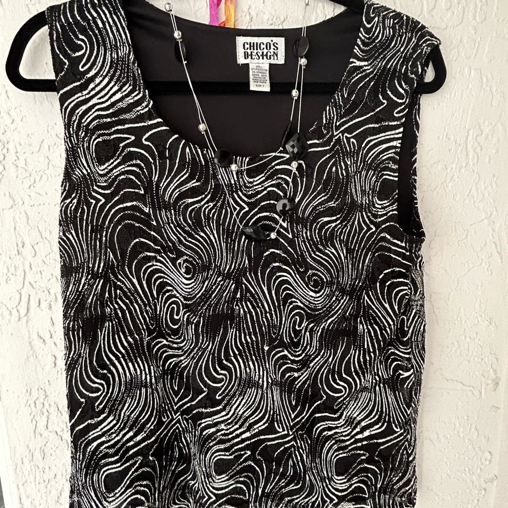 Chicos ladies, size 1, black and white summer blouse. Lacy two layer.